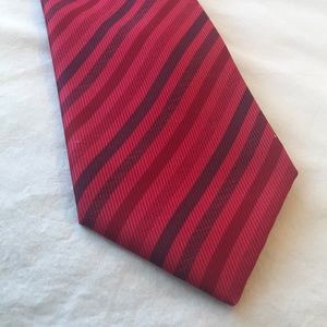 Hermès red monochrome with blue striped tie